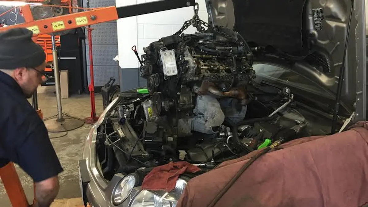 Metal pieces in the oil pan of a failed Mercedes Benz engine at our West Springfield shop