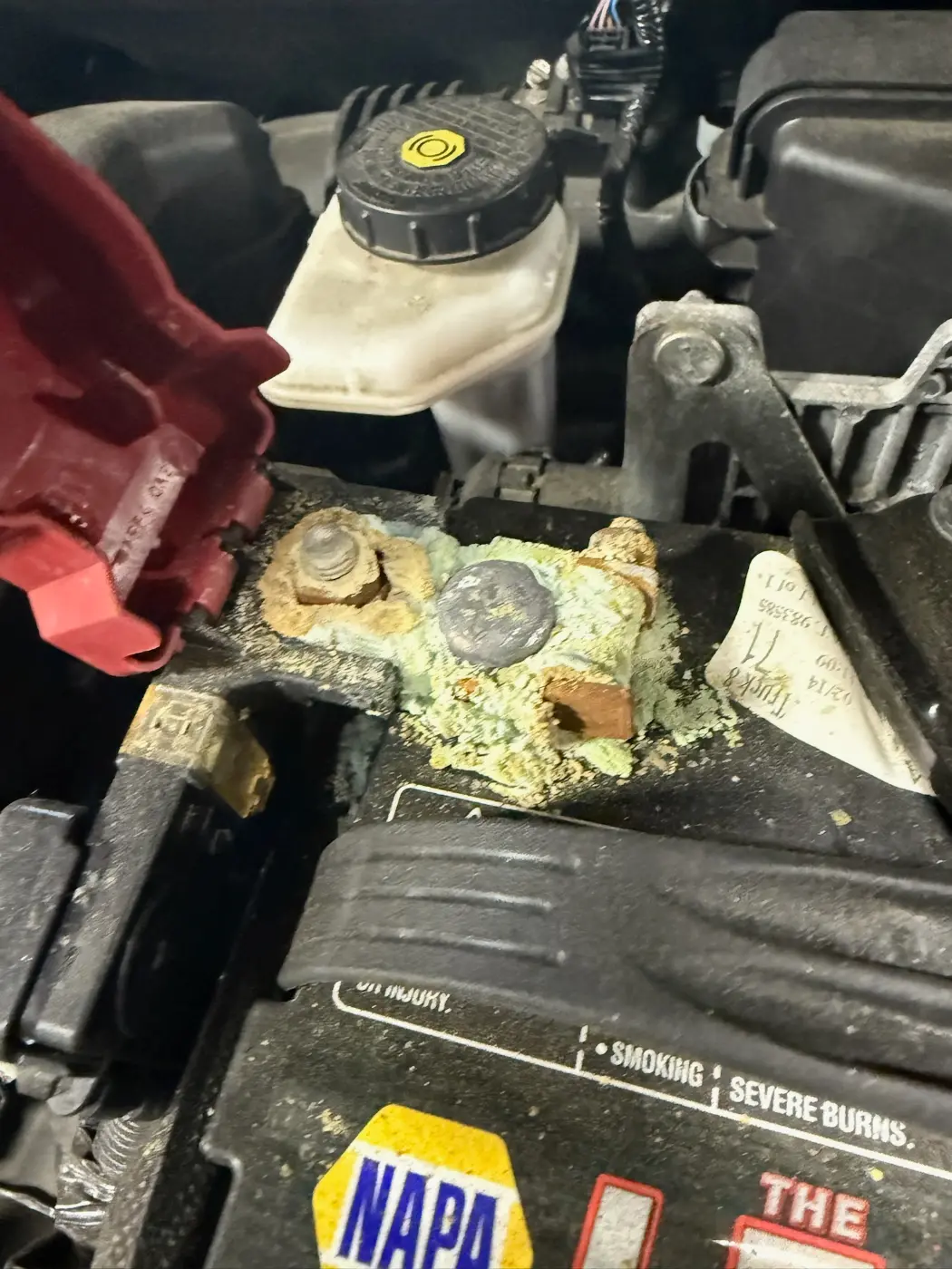 Heavy corrosion on a battery terminal that kept a car from starting, at our South Windsor shop