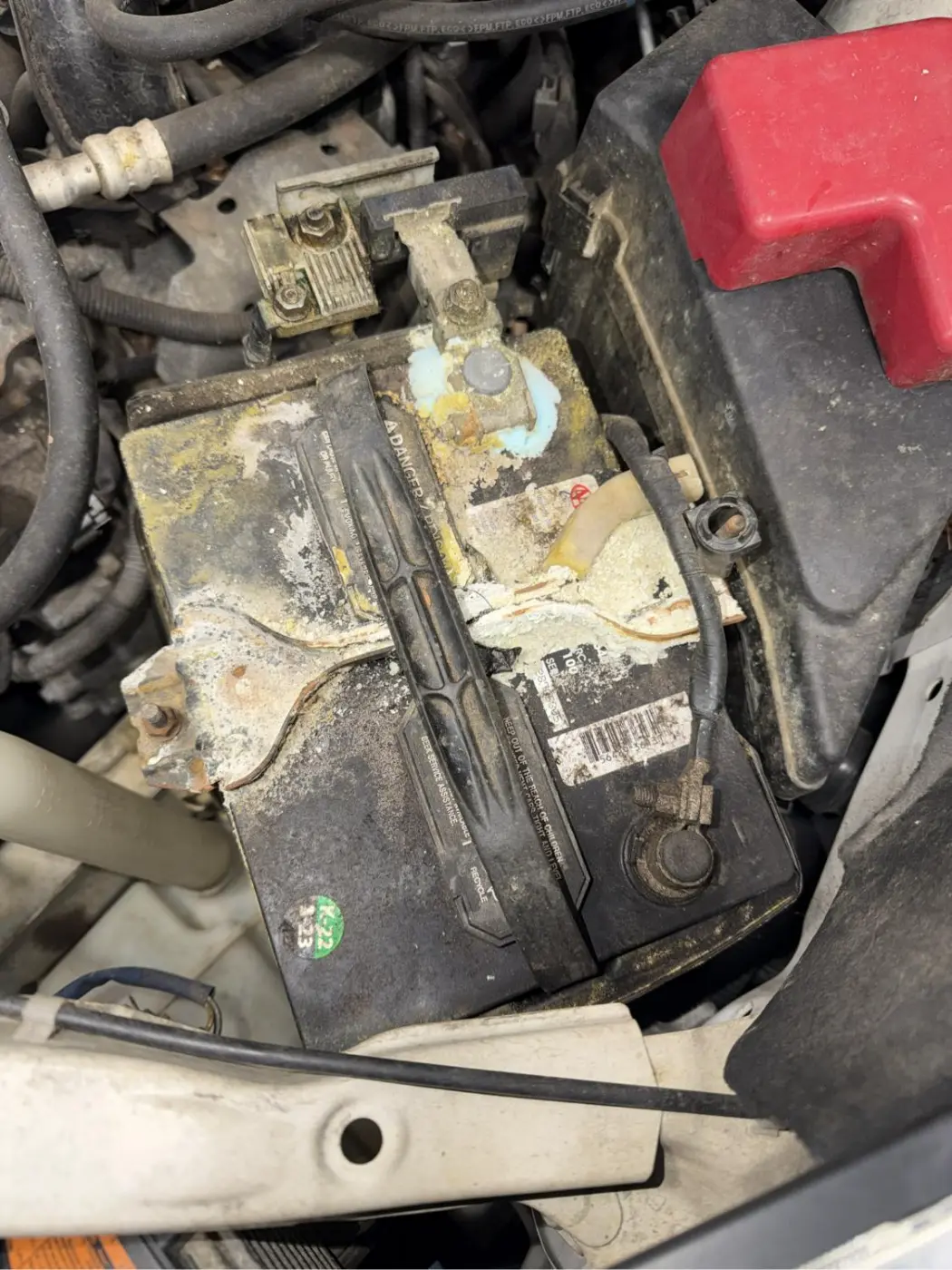 Corroded battery terminals before cleaning at our West Springfield shop