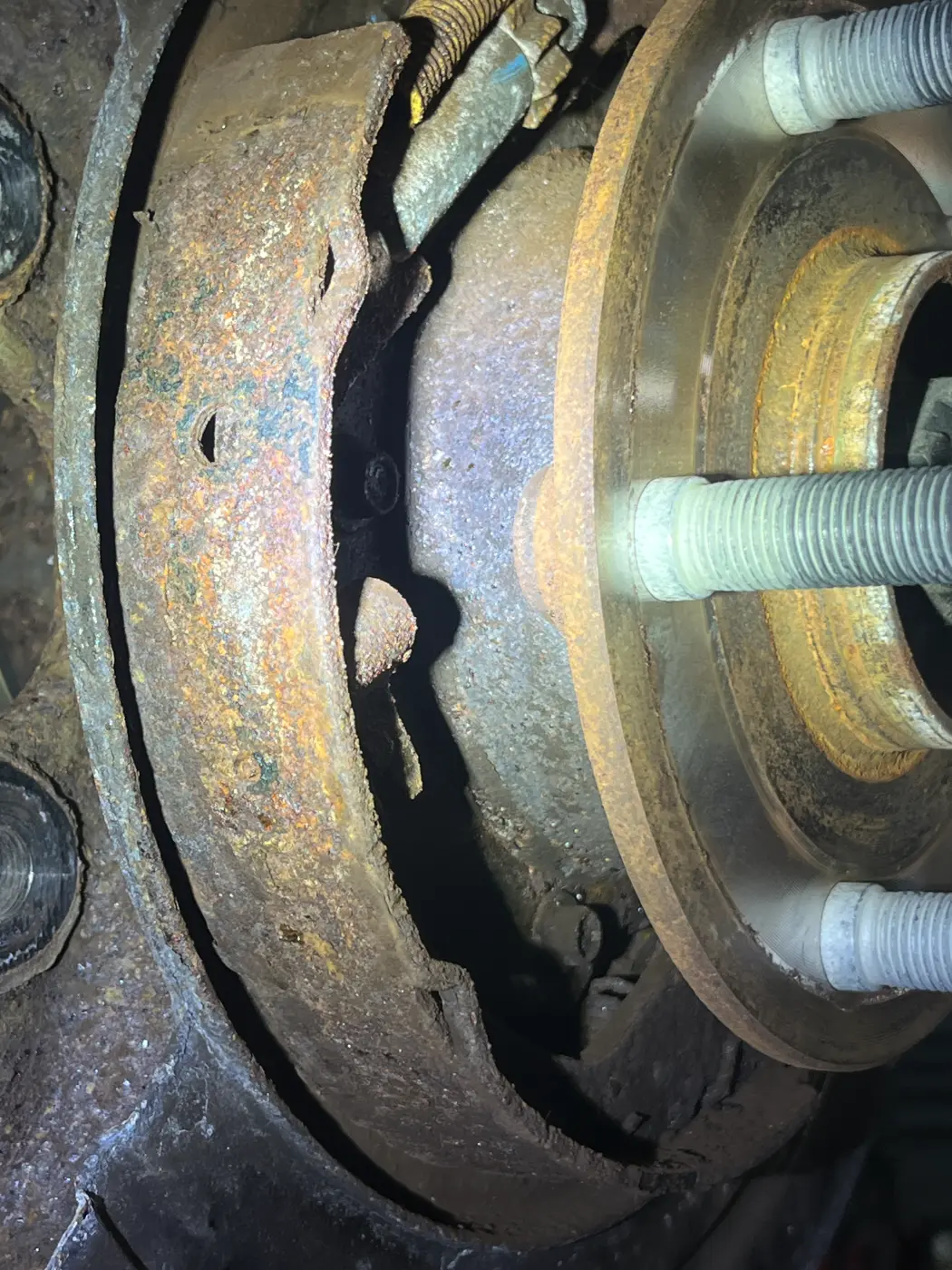 Nissan emergency brake shoe worn down to metal, found after it failed state inspection, at our West Springfield shop