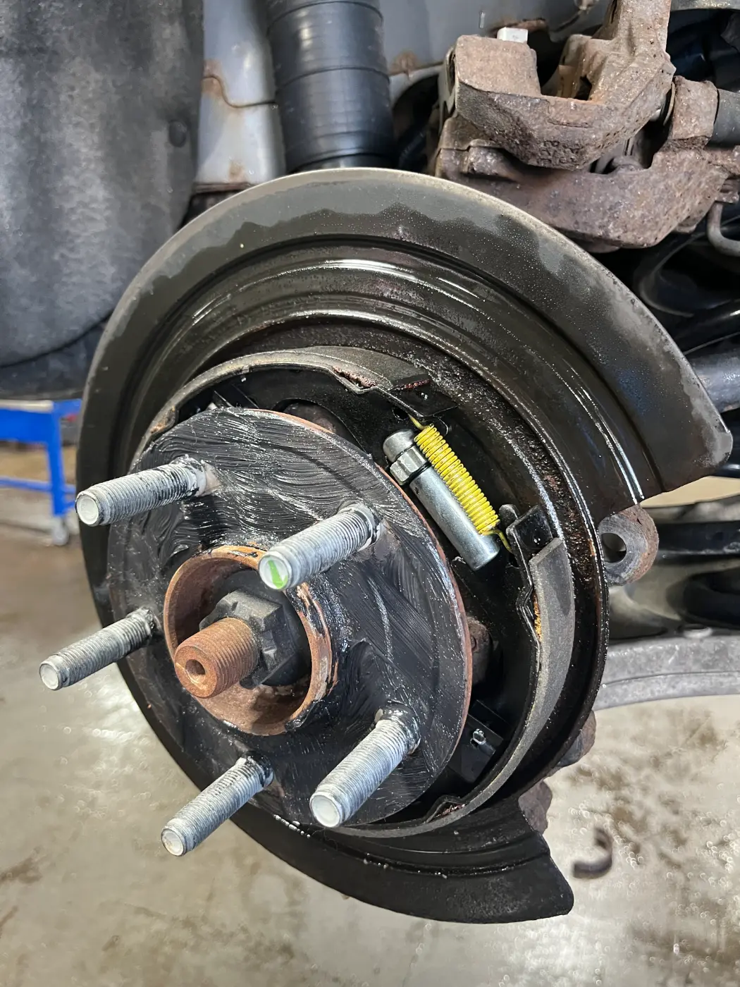 The same Nissan with new emergency brake shoes installed at our West Springfield shop