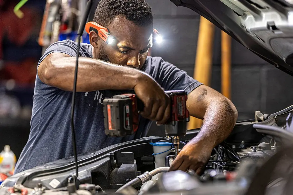 Precision Auto Repair technician working on a car