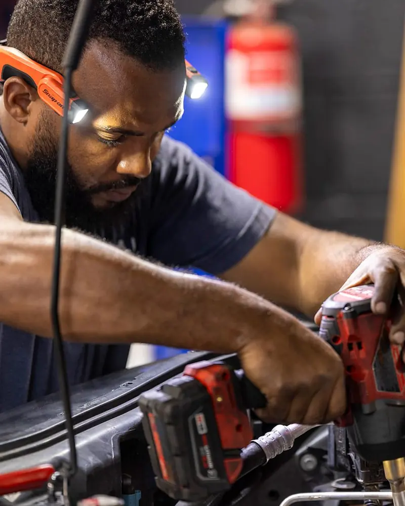 Precision technician replacing a timing belt