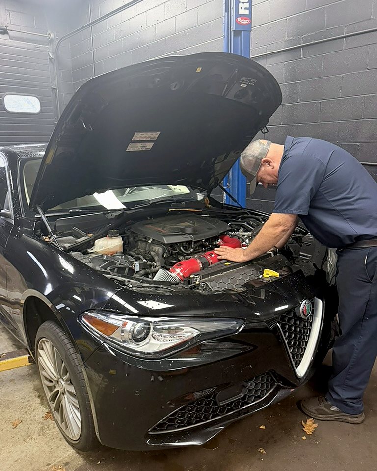 Technician working on a Alfa Romeo